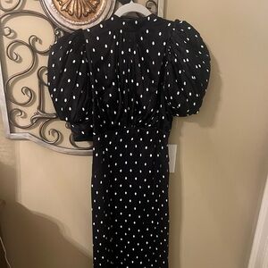 Seen on RHOBH. Ankle length black and white puff sleeve polka dot dress. NWT